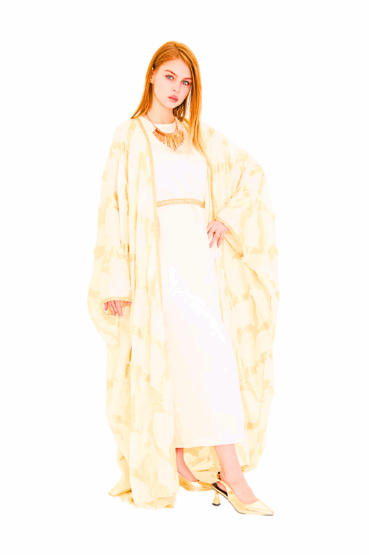 Model wearing the golden mirage luxe kaftan: an ivory silk-blend jacquard kaftan with all-over metallic gold brocade motif, dramatic kimono sleeves, and a removable self-fabric belt